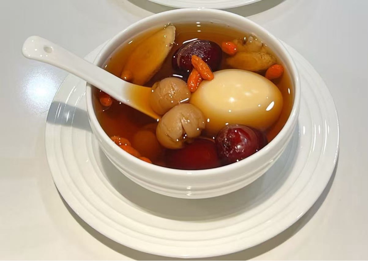 Sweet soup with red dates, goji berries, longan, and egg