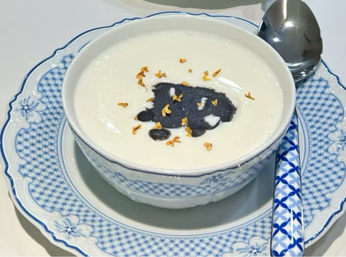Creamy dessert soup served in blue and white tableware